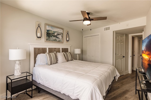 bedroom featuring ceiling fan and dark wood-type flooring