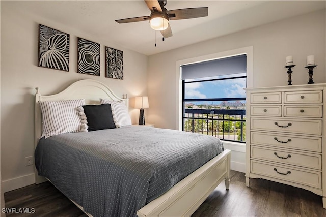 bedroom featuring dark hardwood / wood-style flooring and ceiling fan