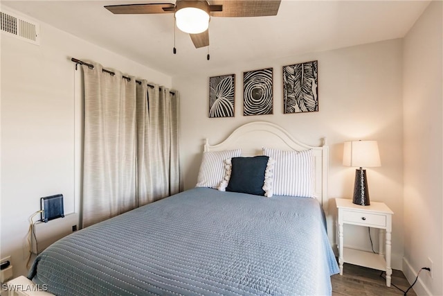 bedroom with hardwood / wood-style floors and ceiling fan