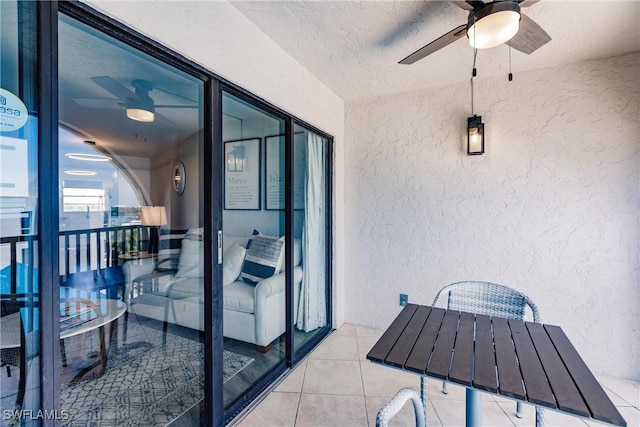 balcony featuring ceiling fan