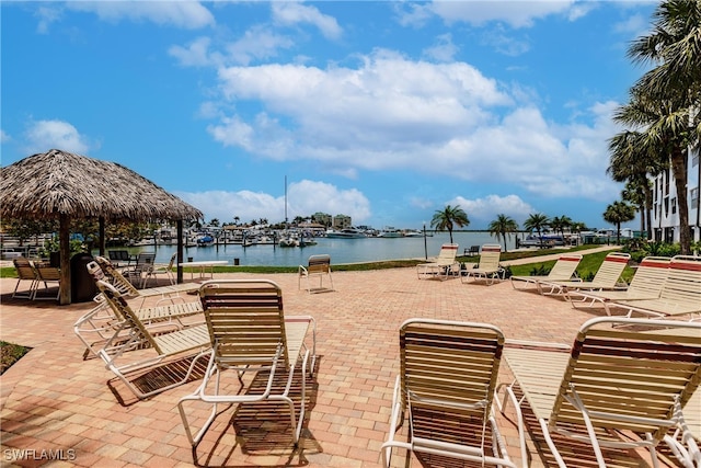 view of patio / terrace featuring a gazebo and a water view