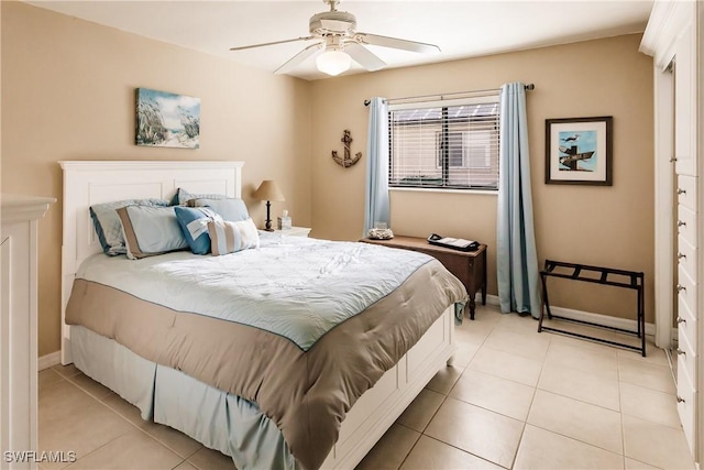 bedroom featuring ceiling fan and light tile patterned flooring