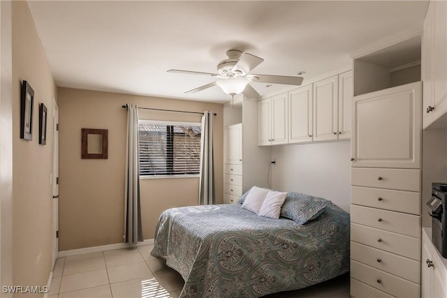 bedroom featuring ceiling fan and light tile patterned floors