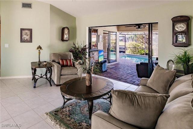 tiled living room featuring ceiling fan