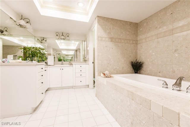 bathroom featuring a tray ceiling, tile patterned flooring, vanity, and tile walls