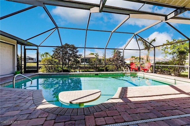 view of pool with a lanai and a patio