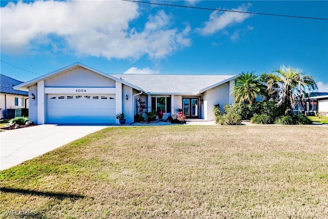 ranch-style home featuring a garage and a front lawn