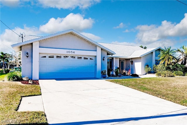 single story home featuring a front yard and a garage