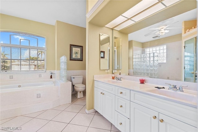 bathroom featuring tile patterned floors, plenty of natural light, ceiling fan, and toilet