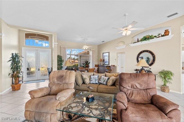 tiled living room with ceiling fan and french doors