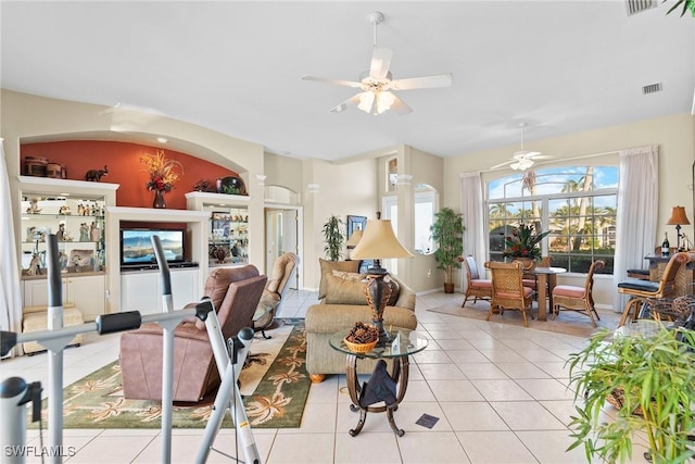 living room with light tile patterned floors and ceiling fan