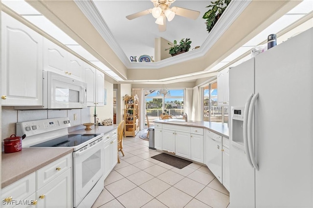 kitchen with white cabinetry, light tile patterned floors, white appliances, and ornamental molding