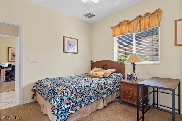 bedroom featuring light colored carpet and ceiling fan