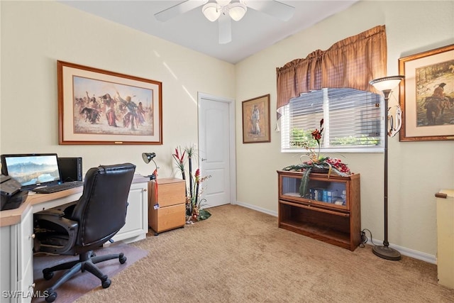 carpeted home office with ceiling fan