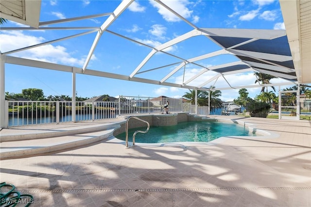 view of pool featuring a patio, a water view, and a lanai