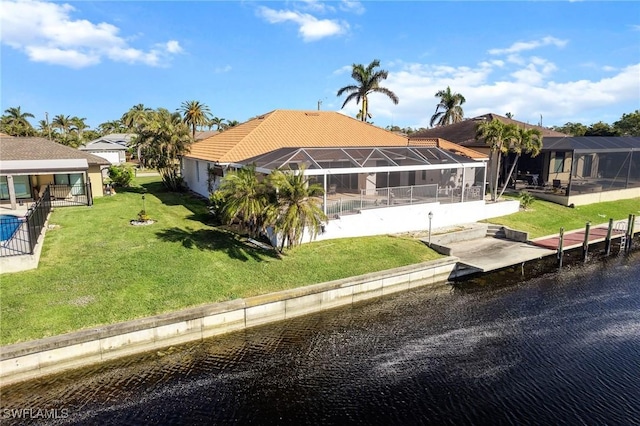 exterior space featuring a water view and a lawn