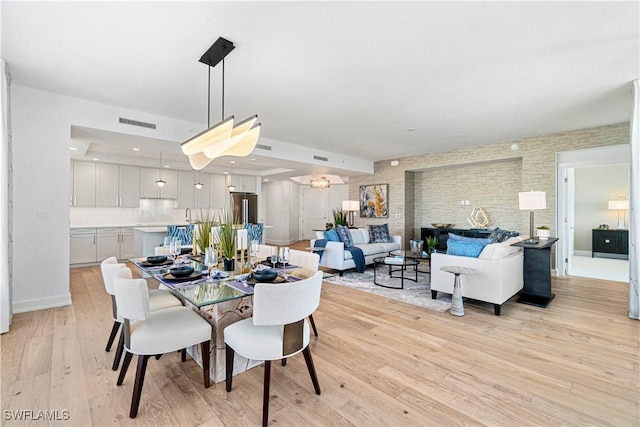 dining area with light hardwood / wood-style flooring