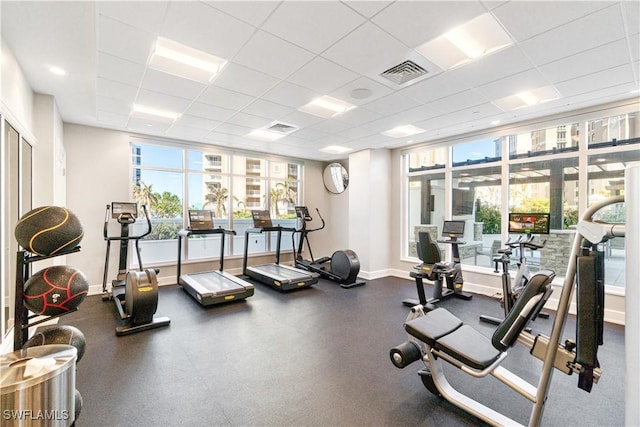 workout area featuring a drop ceiling