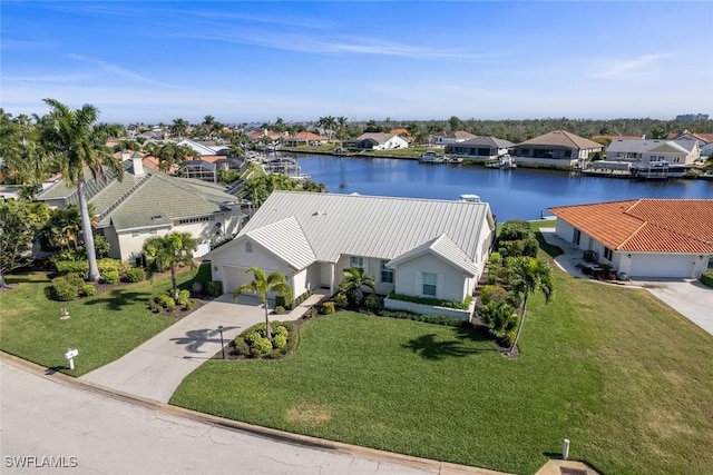 drone / aerial view with a water view