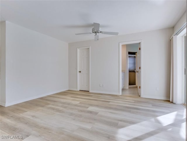 unfurnished bedroom featuring ensuite bath, ceiling fan, and light hardwood / wood-style flooring