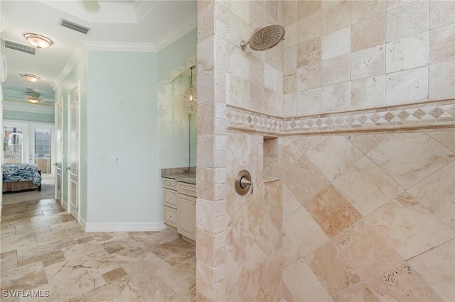 bathroom featuring tiled shower, vanity, ornamental molding, and french doors