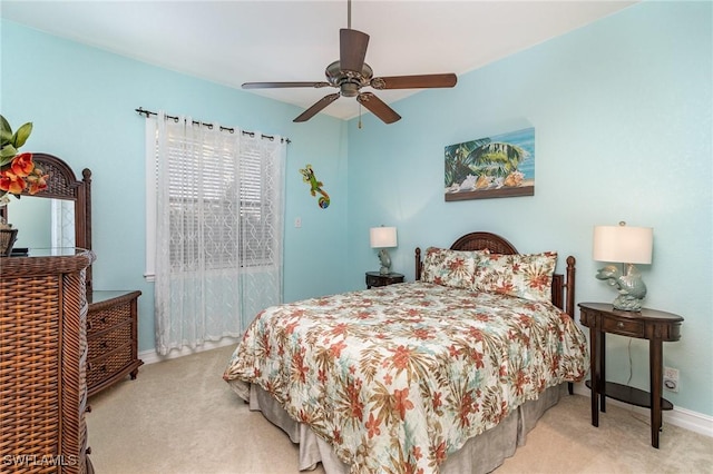 bedroom featuring light carpet and ceiling fan