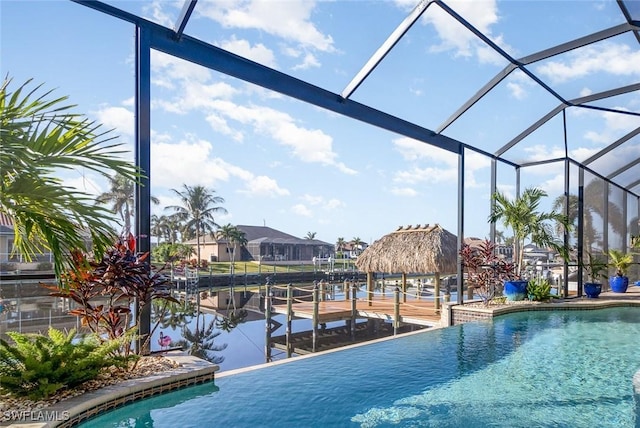 view of swimming pool with a lanai