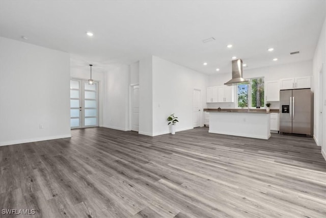 unfurnished living room featuring light wood-type flooring