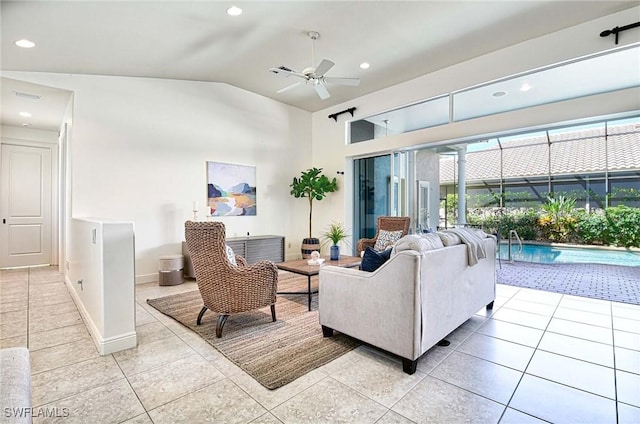 living room featuring light tile patterned floors, ceiling fan, and lofted ceiling