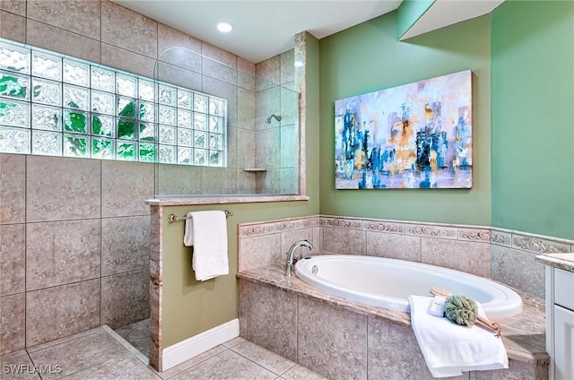 bathroom featuring tile patterned floors, vanity, and independent shower and bath