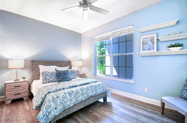 bedroom featuring hardwood / wood-style flooring and ceiling fan