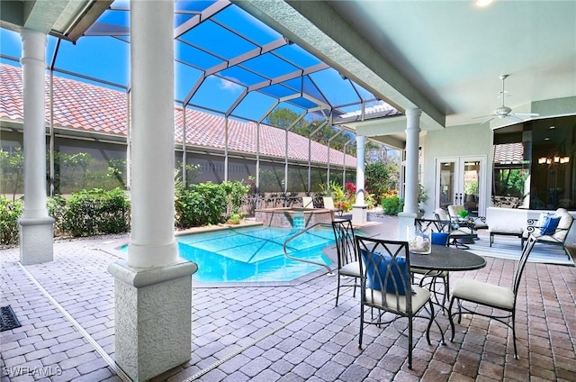 view of swimming pool featuring ceiling fan, a patio area, an in ground hot tub, and french doors