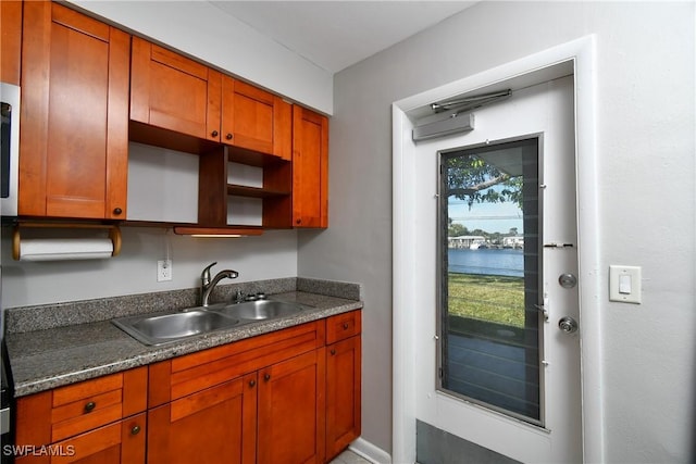 kitchen featuring sink and a water view