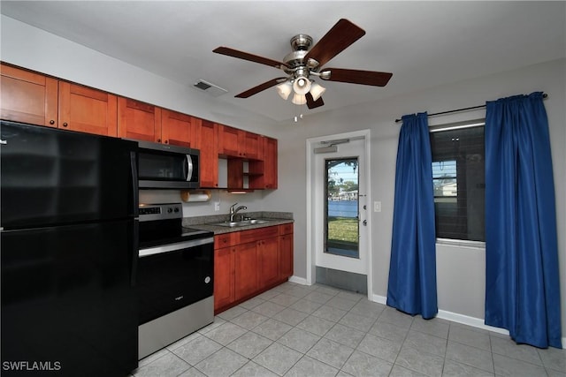 kitchen with ceiling fan, sink, light tile patterned floors, and appliances with stainless steel finishes