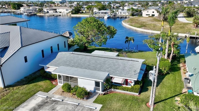 birds eye view of property with a water view