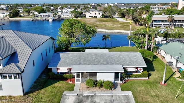 birds eye view of property with a water view