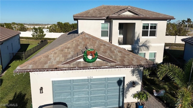 view of front of property with a garage