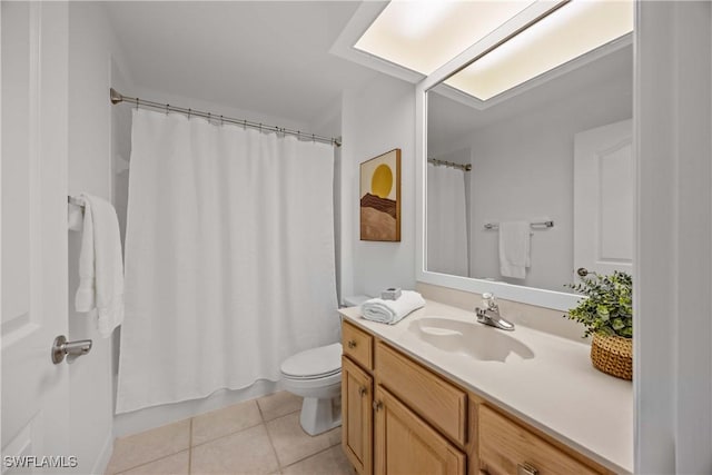 bathroom featuring curtained shower, tile patterned flooring, vanity, and toilet