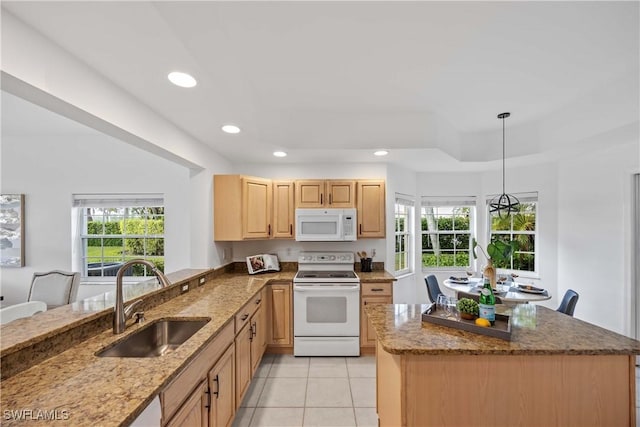 kitchen featuring sink, light stone counters, decorative light fixtures, white appliances, and light tile patterned floors