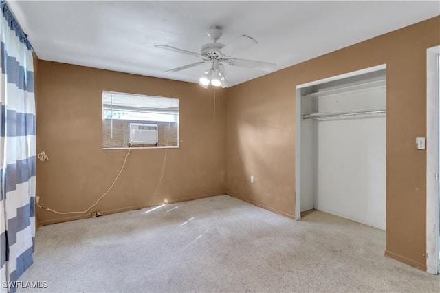 unfurnished bedroom featuring ceiling fan, a closet, cooling unit, and light carpet