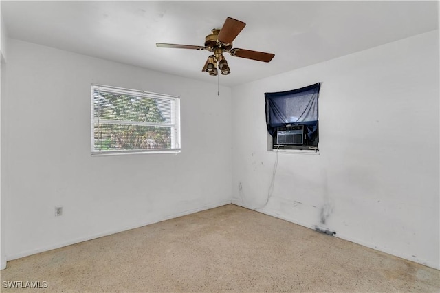 unfurnished room with cooling unit and ceiling fan