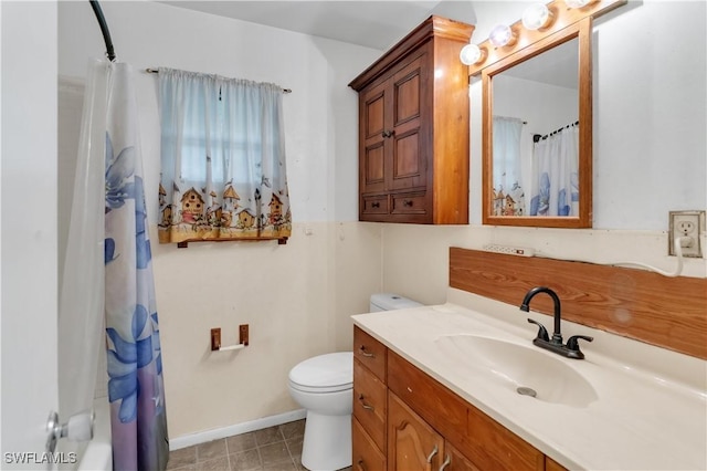 bathroom featuring vanity, toilet, and walk in shower