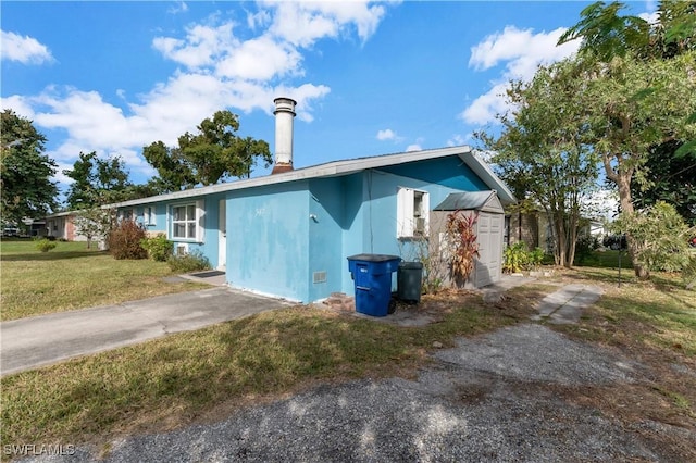 view of property exterior with a lawn