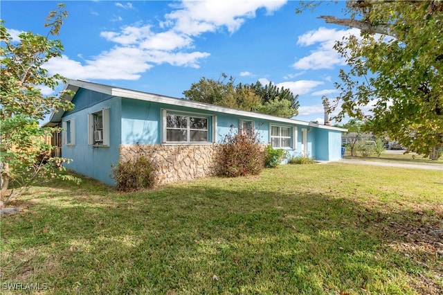 ranch-style house with a front yard