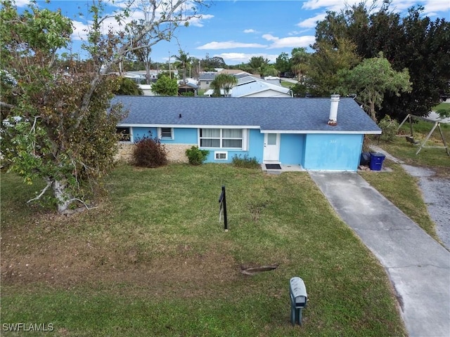 ranch-style home with a front lawn