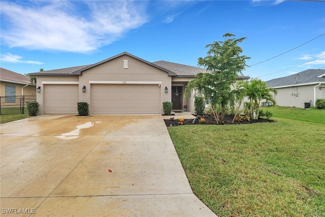 ranch-style house with a garage and a front lawn