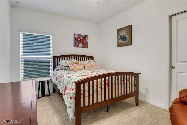 bedroom with light carpet