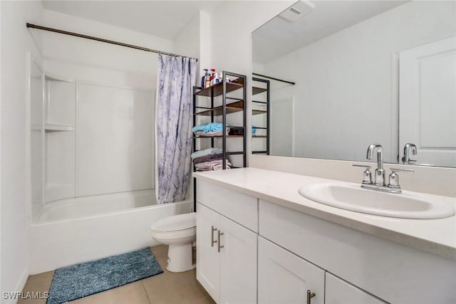 full bathroom featuring shower / bath combo with shower curtain, tile patterned flooring, vanity, and toilet