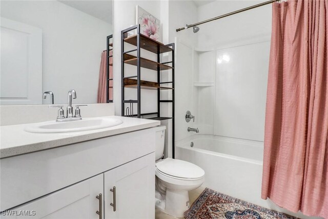 full bathroom featuring vanity, toilet, and shower / bath combo with shower curtain