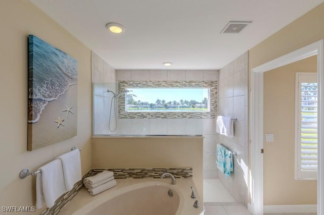 bathroom with tile patterned flooring and plus walk in shower